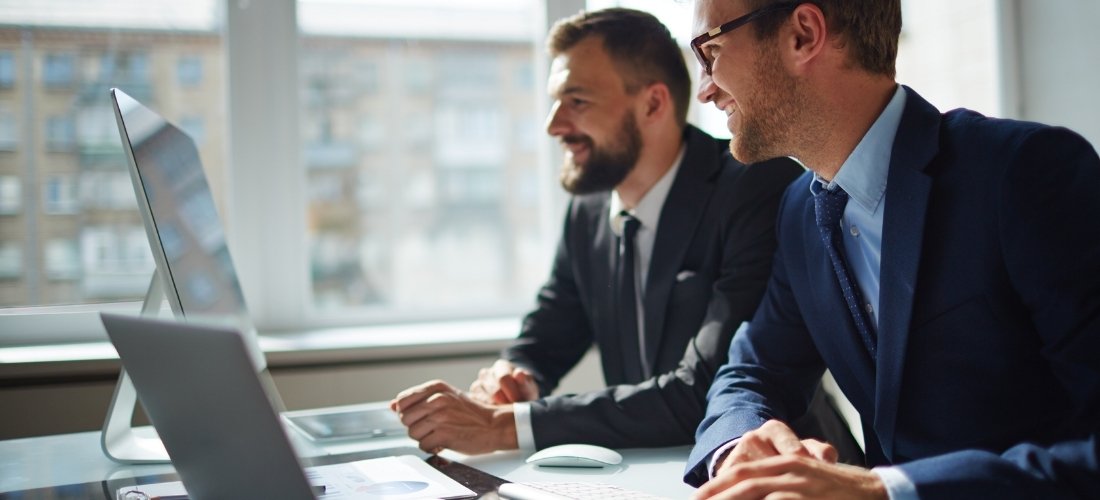 Businessmen checking the advantages of taking a VAT Loan to Manage Cashflow